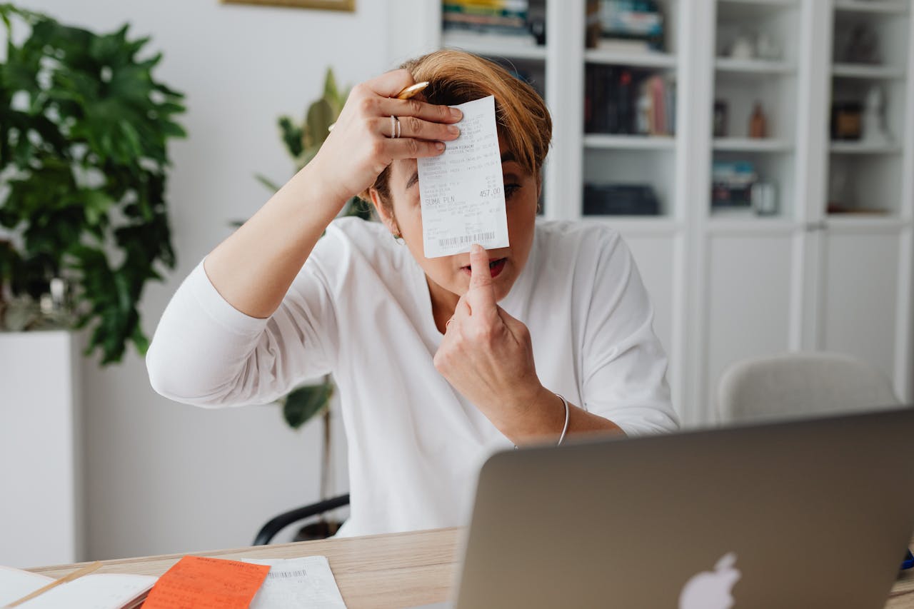 why-choose-us Businesswoman showing a receipt during a home office work session, highlighting technology integration.